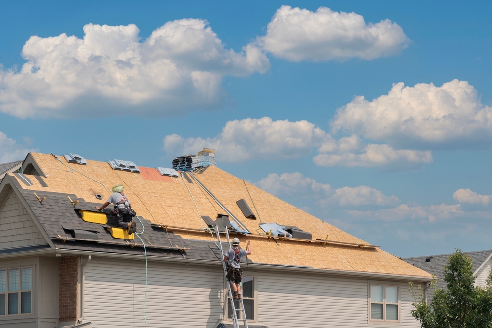 Roofer inspecting roof